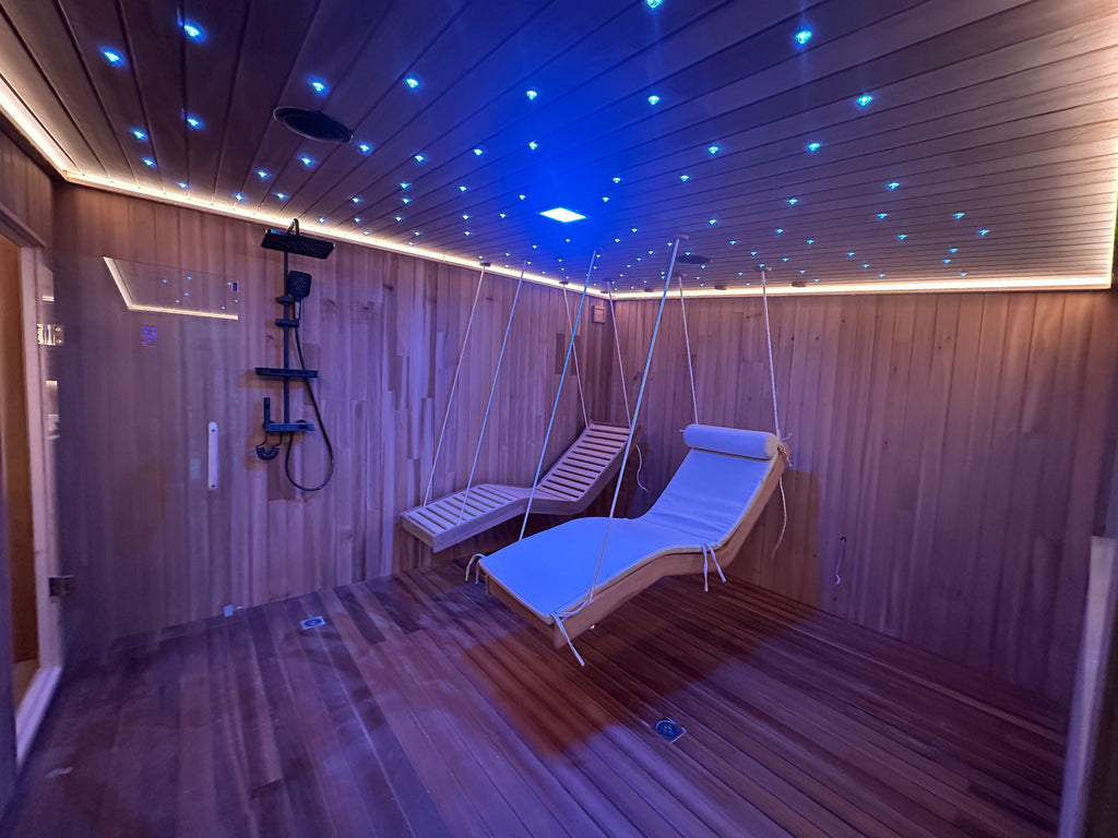 Large - sized sauna, suitable for 4 - 6 people, with bathroom facilities inside and a customized hanging chair.