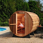 Custom - made outdoor barrel - shaped sauna for 4 - 6 people. It is a steam sauna made of Canadian red cedar, equipped with an electric heater and sauna stones.