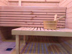 A modern indoor solid - wood sauna suite in a square - shaped room suitable for 2 - 4 people, equipped with an electric furnace and a control panel.