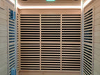 Modern square - shaped villa outdoor sauna made of dawn redwood, featuring full - spectrum infrared and red - light therapy, a digital control panel, and a steam indoor sauna function.