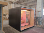 Outdoor square - shaped sauna. A Canadian fir/red cedar cube - shaped sauna equipped with two - layer benches and light strips.