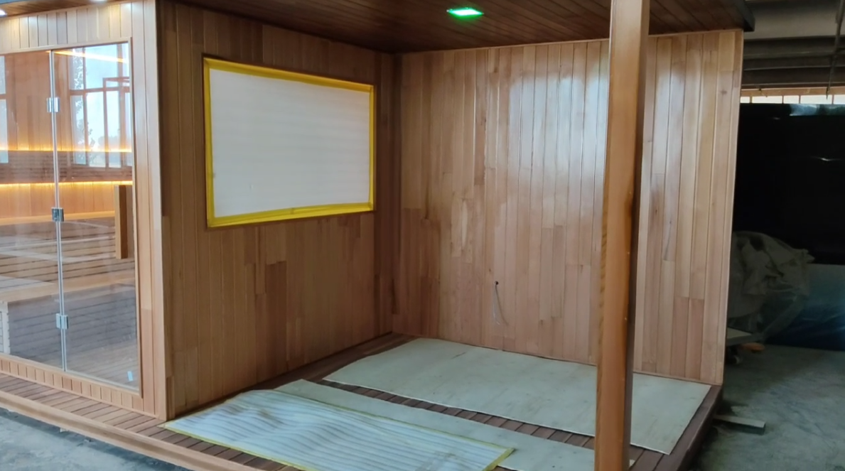 Custom - made rectangular integrated roof sauna. It is a waterproof dry - steaming house in the outdoor garden, heated by an electric furnace with sauna stones, and equipped with customized shower facilities.
