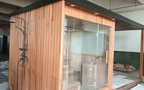 Custom - made rectangular integrated roof sauna. It is a waterproof dry - steaming house in the outdoor garden, heated by an electric furnace with sauna stones, and equipped with customized shower facilities.