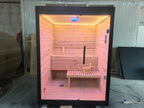 A modern indoor solid - wood sauna suite in a square - shaped room suitable for 2 - 4 people, equipped with an electric furnace and a control panel.
