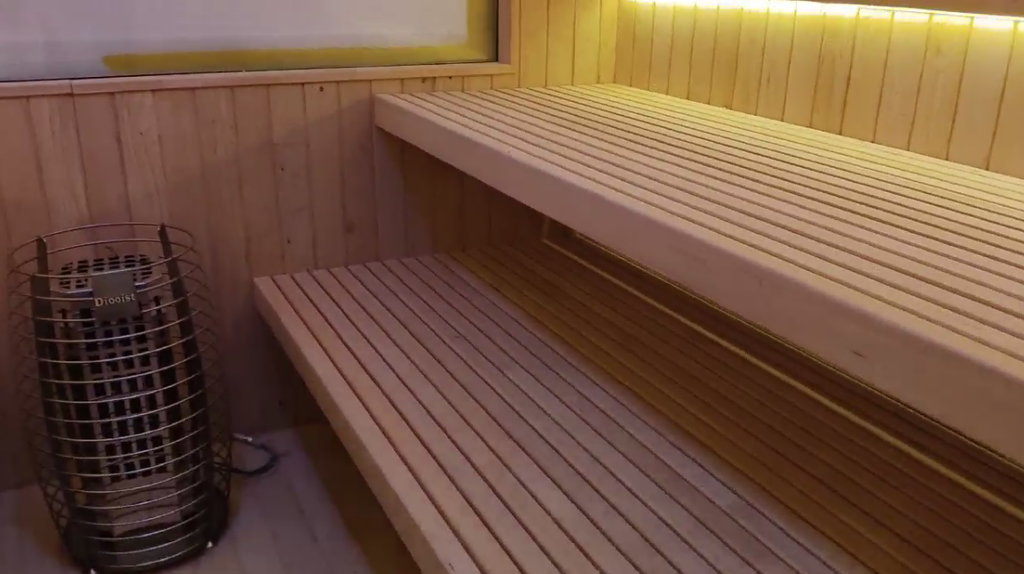 Custom - made square solid - wood sauna room. It uses an electric - furnace for constant - temperature heating and serves as a home - use indoor dry - steaming room. The size can be adjusted as required for villas and homestays.