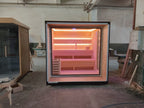 Outdoor square - shaped sauna. A Canadian fir/red cedar cube - shaped sauna equipped with two - layer benches and light strips.