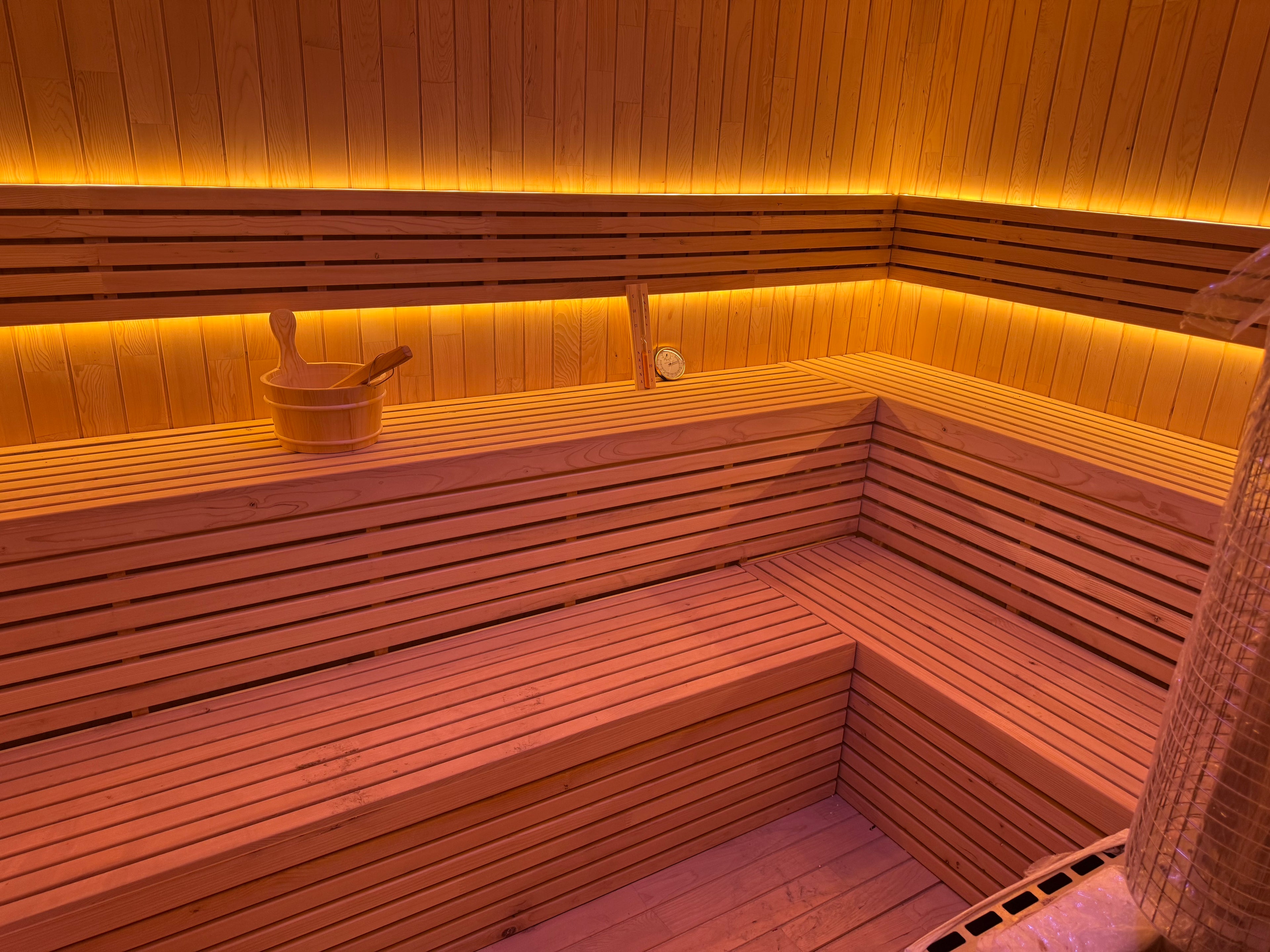 Luxurious square - shaped modern villa sauna made of solid red - cedar wood. It features a custom - designed layout, offers an outdoor panoramic view, and the dry - steam function can be customized.