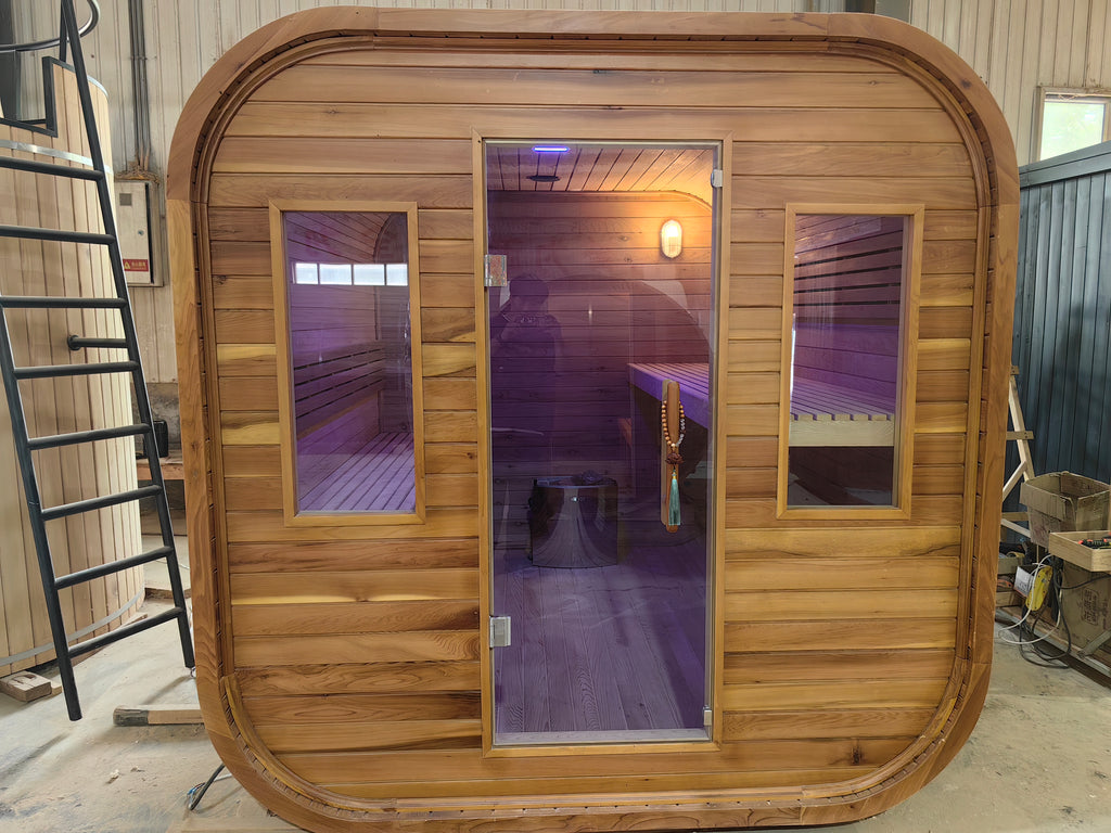 A stylish outdoor sauna cube with a wet - steam function, a computer control panel, made of western red cedar, suitable for 4 - 5 people.
