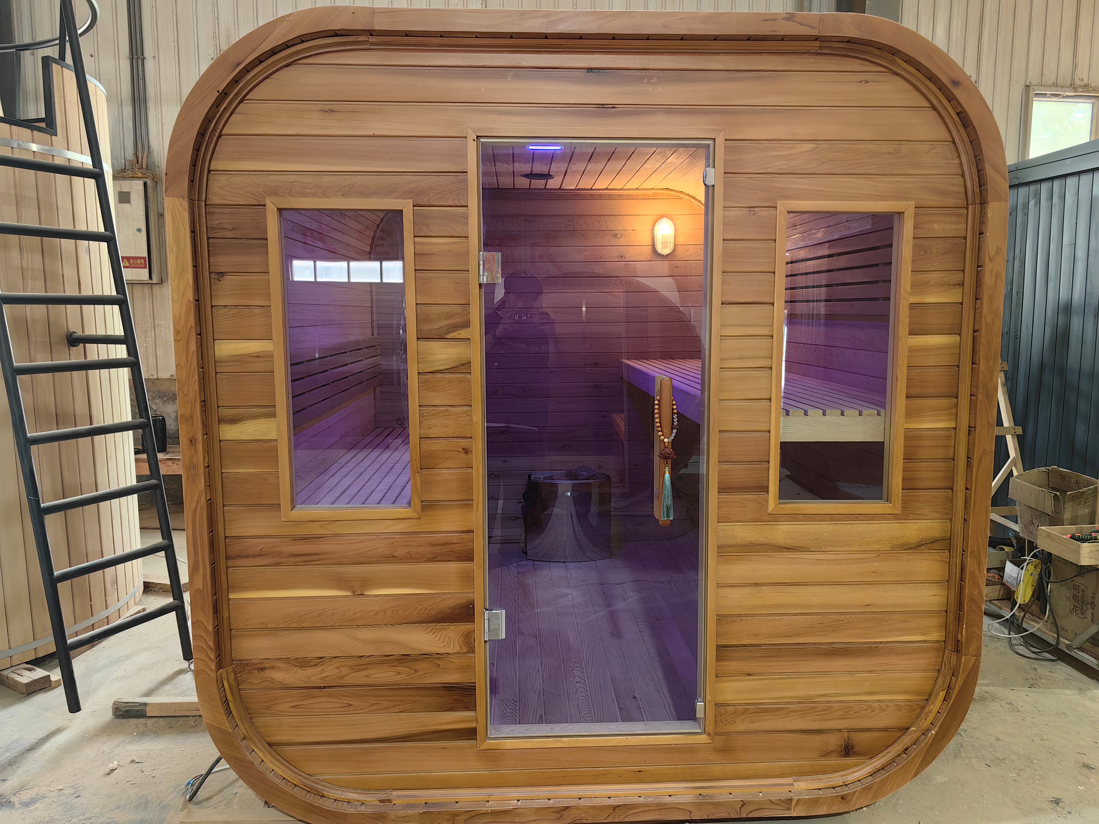 A stylish outdoor sauna cube with a wet - steam function, a computer control panel, made of western red cedar, suitable for 4 - 5 people.