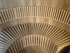 Customize an outdoor barrel - shaped sauna for 4 - 6 people. It is a Canadian red cedar wood steam sauna with a terrace, equipped with an electric heater and sauna stones.
