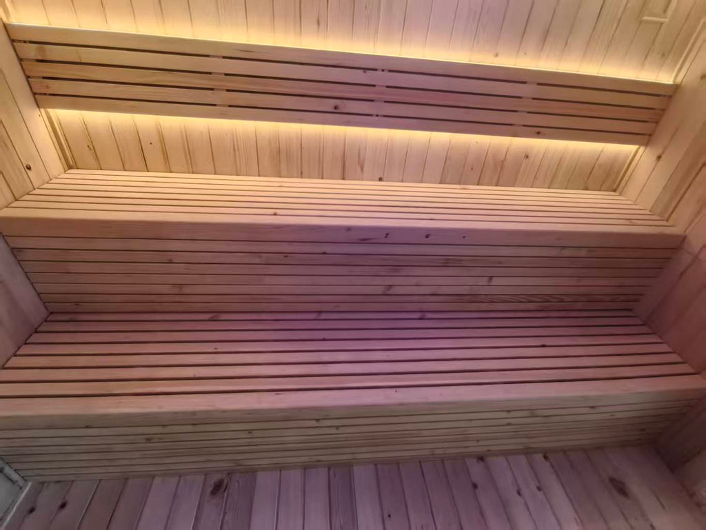 Luxurious 6 - person outdoor black square - shaped sauna. Made of spruce, in a cube shape, equipped with a 6KW heater and LED lights, suitable for use in an outdoor spa.