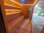 Luxurious 6 - person outdoor black square - shaped sauna. Made of spruce, in a cube shape, equipped with a 6KW heater and LED lights, suitable for use in an outdoor spa.