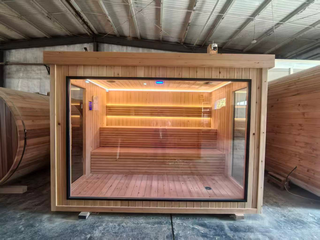 Luxurious 6 - person outdoor black square - shaped sauna. Made of spruce, in a cube shape, equipped with a 6KW heater and LED lights, suitable for use in an outdoor spa.