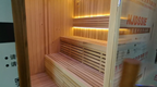 Outdoor luxury modern far - infrared sauna room, equipped with a shower room, waterproof. It is heated by an electric furnace with sauna stones and controlled by a control panel, suitable for use in the backyard garden.