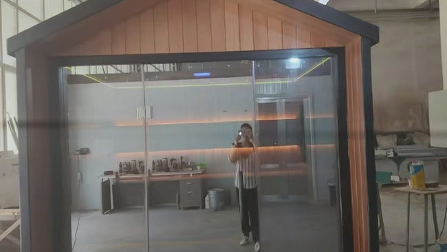 Custom - designed modern - style pointed - roof electric - heated sauna room. It is suitable for use in apartments, features a redwood structure, and has environmental - friendly functions. Hover Image