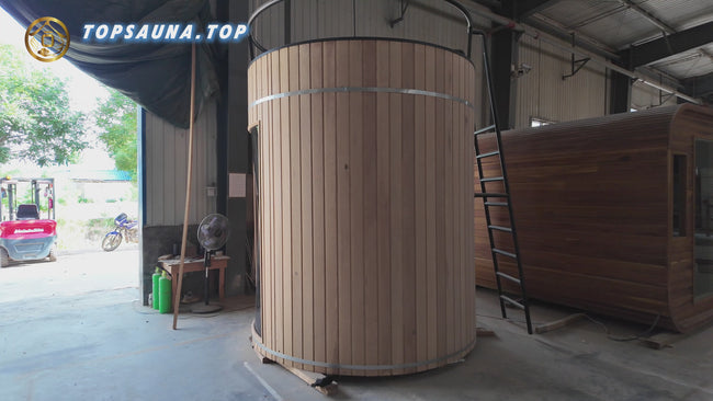 The factory's new design of a barrel - shaped sauna, made of red cedar. It's an outdoor wooden brown panoramic sauna barrel with a customized ladder and a balcony. Hover Image